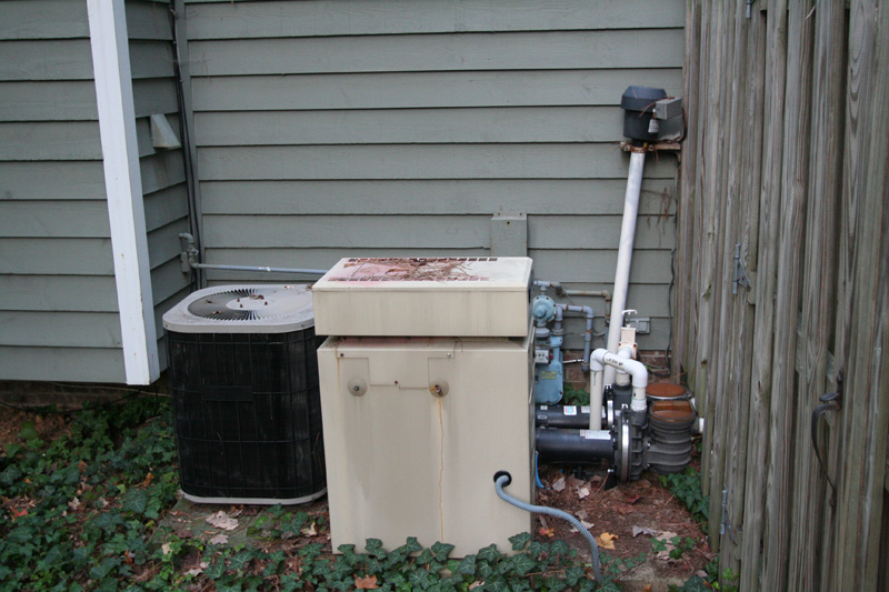 old AC unit and hot tub heater/pump