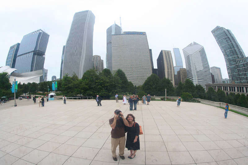 us and the skyline as reflected in the Cloud Gate