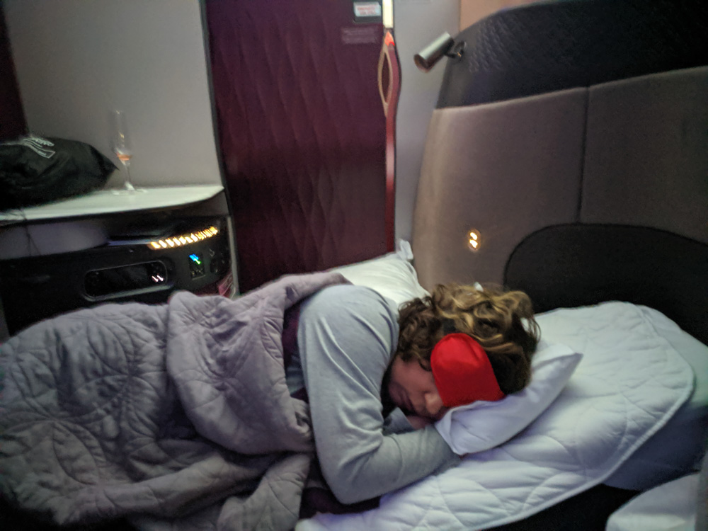 sleeping comfortably on a plane