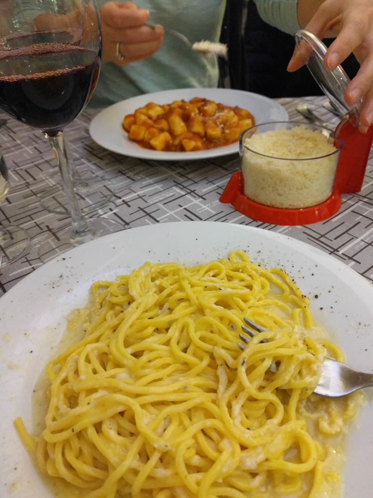 tonnarelli cacio e pepe (bottom) and gnocchi bolognese (top)